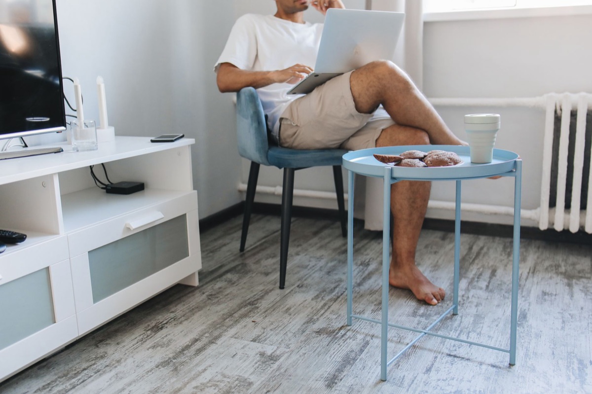 Wireless router in living room with various IoT devices nearby