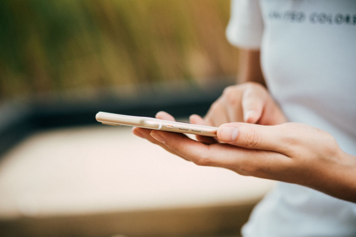User checking phone for security signs